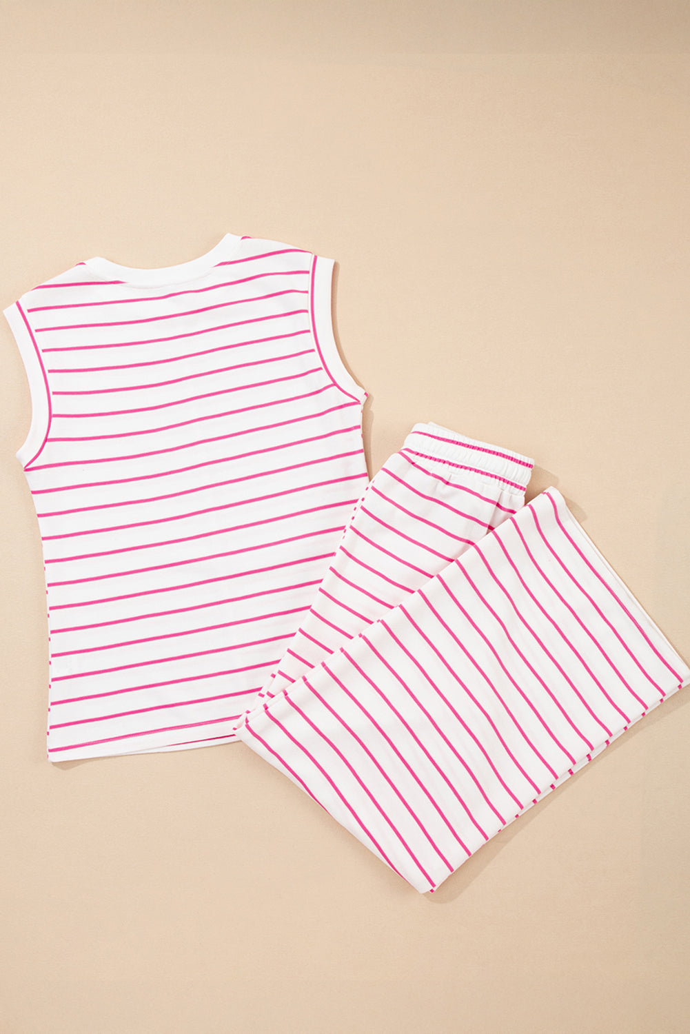 Conjunto Sail Blue Casual Striped Tee and Wide Leg Pants Set branco com riscas azuis, composto por t-shirt sem mangas e calças largas, ideal para conforto e estilo casual. suplementos premium naturais para energia, vitalidade e saúde cognitiva, desenvolvidos para o mercado português.