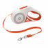 Leash branco e laranja com botões para controlo, projetado para conforto e segurança durante passeios noturnos com o Automatic Retractable Lighting Dog Leash.