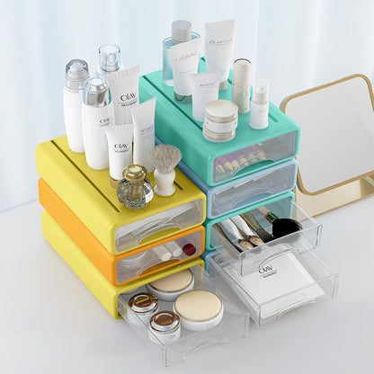 Organizador colorido com vários compartimentos transparentes contendo cosméticos, pincéis e artigos de higiene, ilustrando uso prático do Office home desktop cosmetics stationery transparent storage box drawer type sundries storage box, ideal para suplementos premium naturais para energia, vitalidade e saúde cognitiva, desenvolvidos para o mercado português.