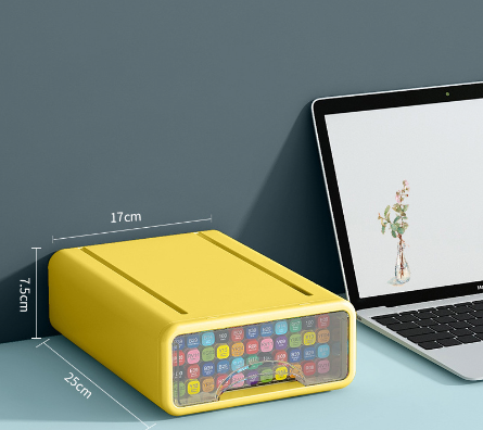 Caixa de armazenamento transparente tipo gaveta Office home desktop cosmetics stationery transparent storage box drawer type sundries storage box amarela ao lado de laptop, ideal para organização de suplementos premium naturais para energia, vitalidade e saúde cognitiva.